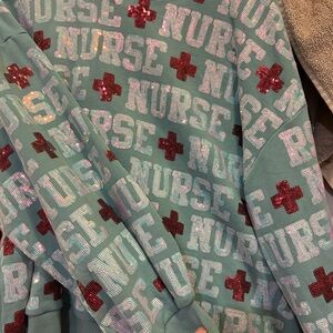 QUEEN OF SPARKLES Teal Sweatshirt with Red Details